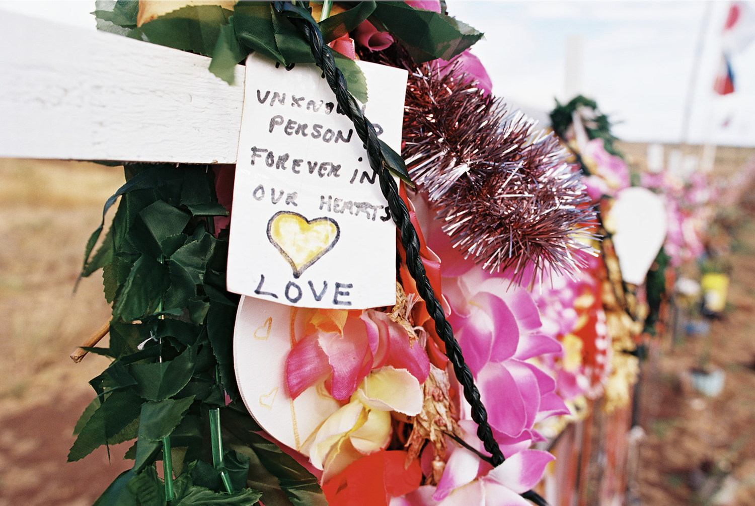 Maui fires in Lahaina aftermath featuring one of the many memorials to those lost in the fires